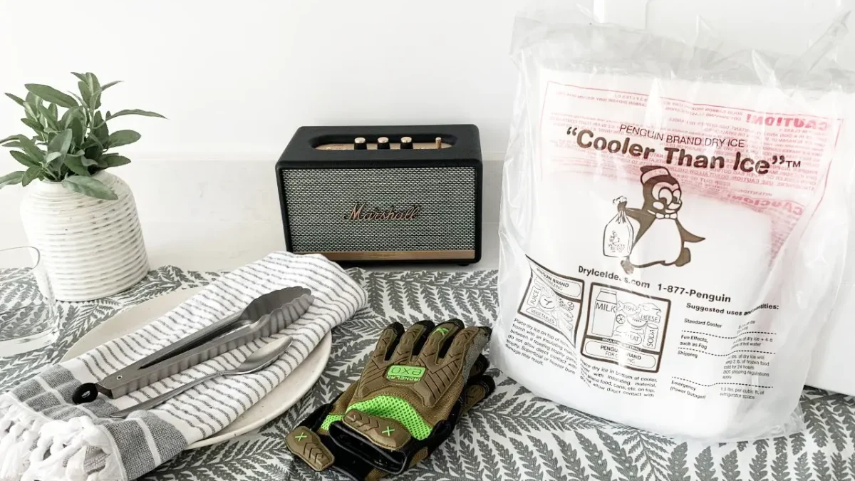 Table setting with dry ice, gloves, and a Marshall speaker.