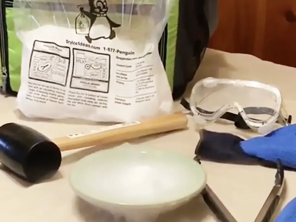 Dry ice safety equipment: goggles, gloves, mallet, and BryIceIdeas dry ice.