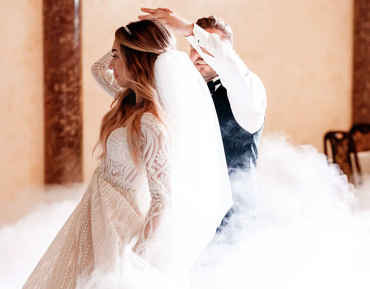 Bride and groom's first dance in a cloud of fog