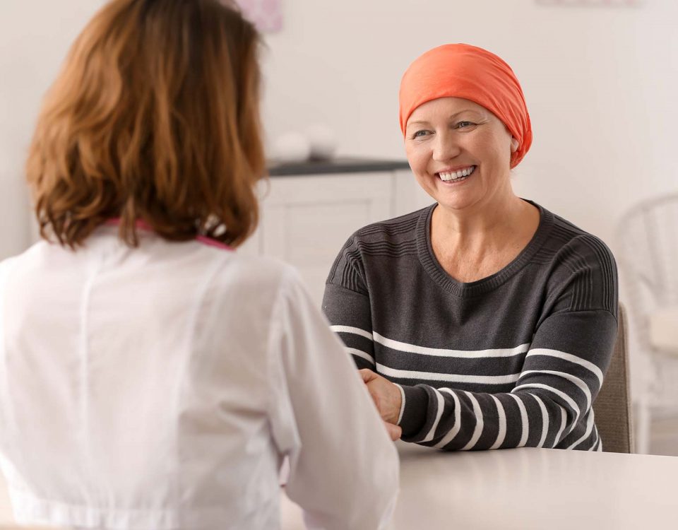 A chemotherapy patient consults her doctor.